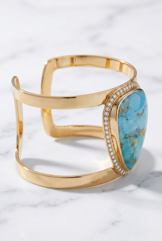 Side view showing spaced gold-tone bands and raised blue cabochon setting